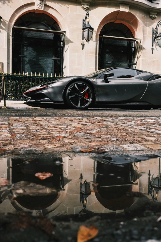 a black car parked outside of a building