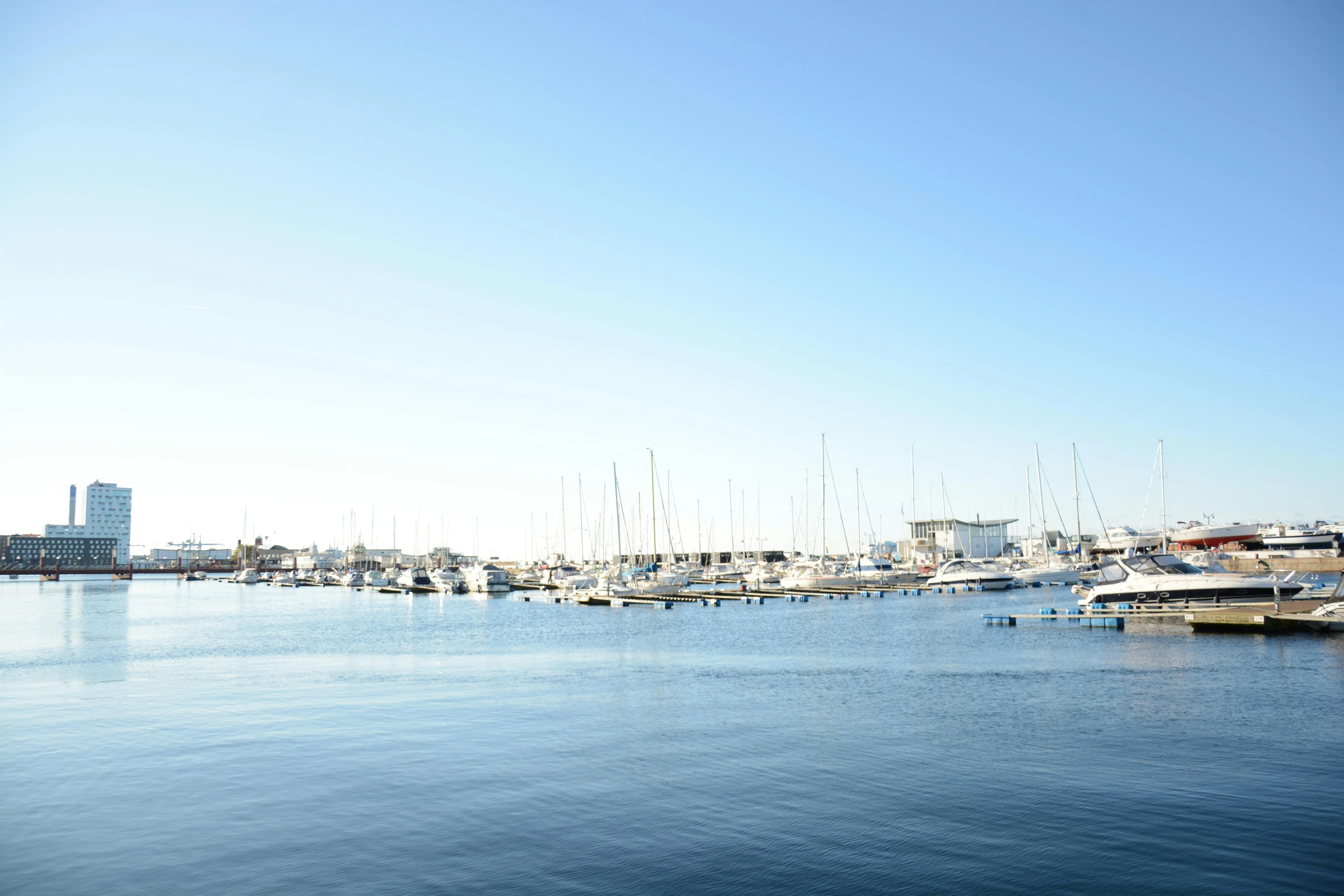 a bunch of boats sit in the water together