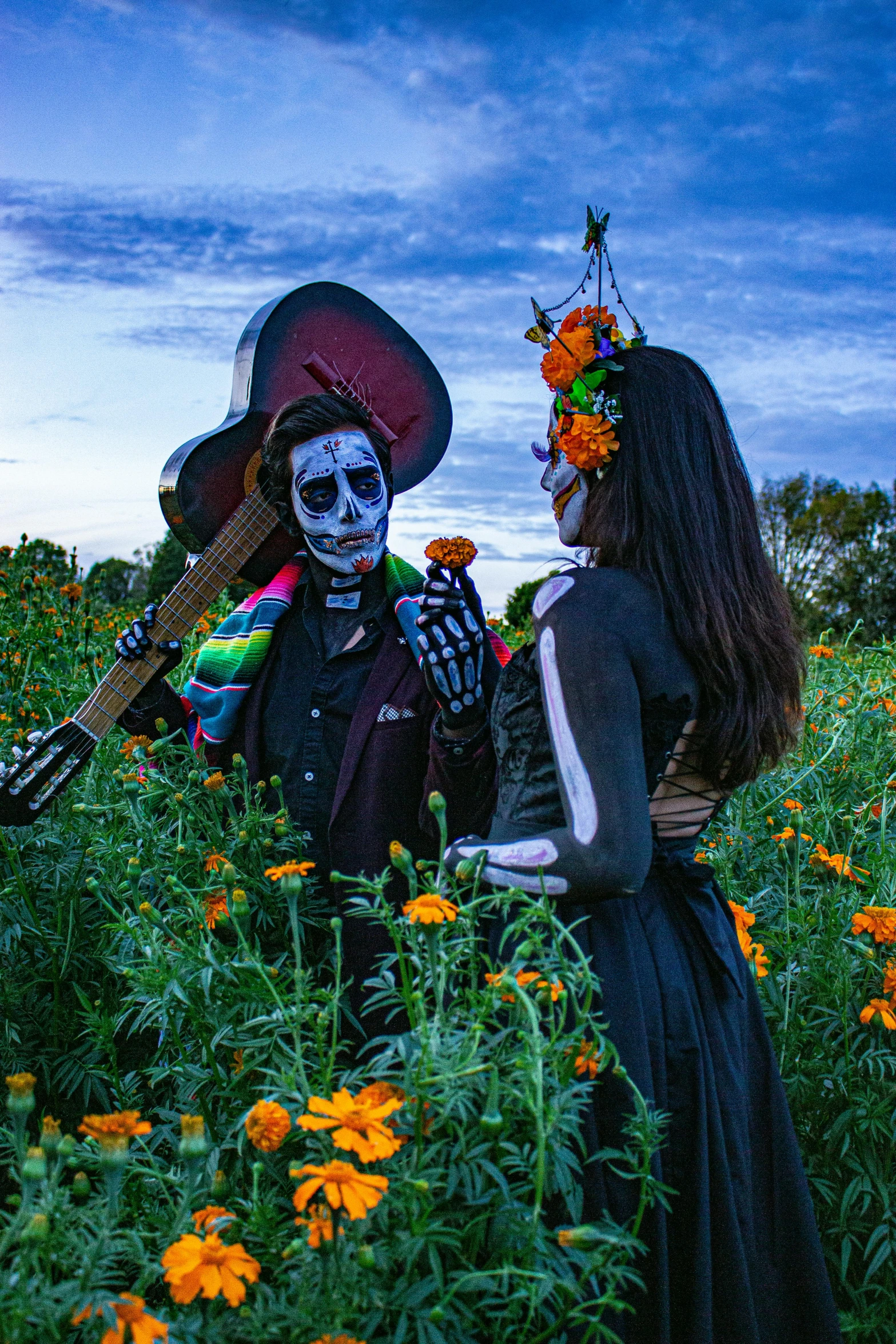 a couple of people that are in some flowers