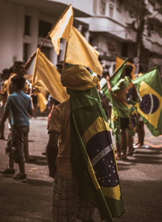 a person is standing on a street in the parade