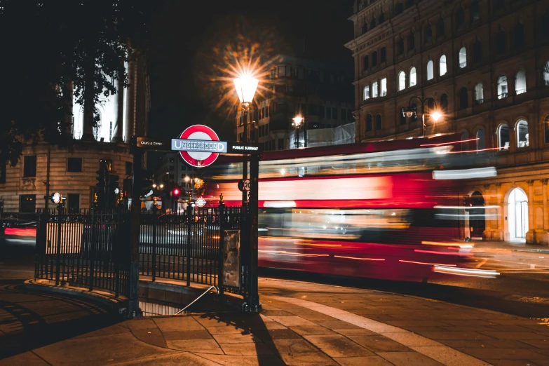 a double decker bus on the street at night