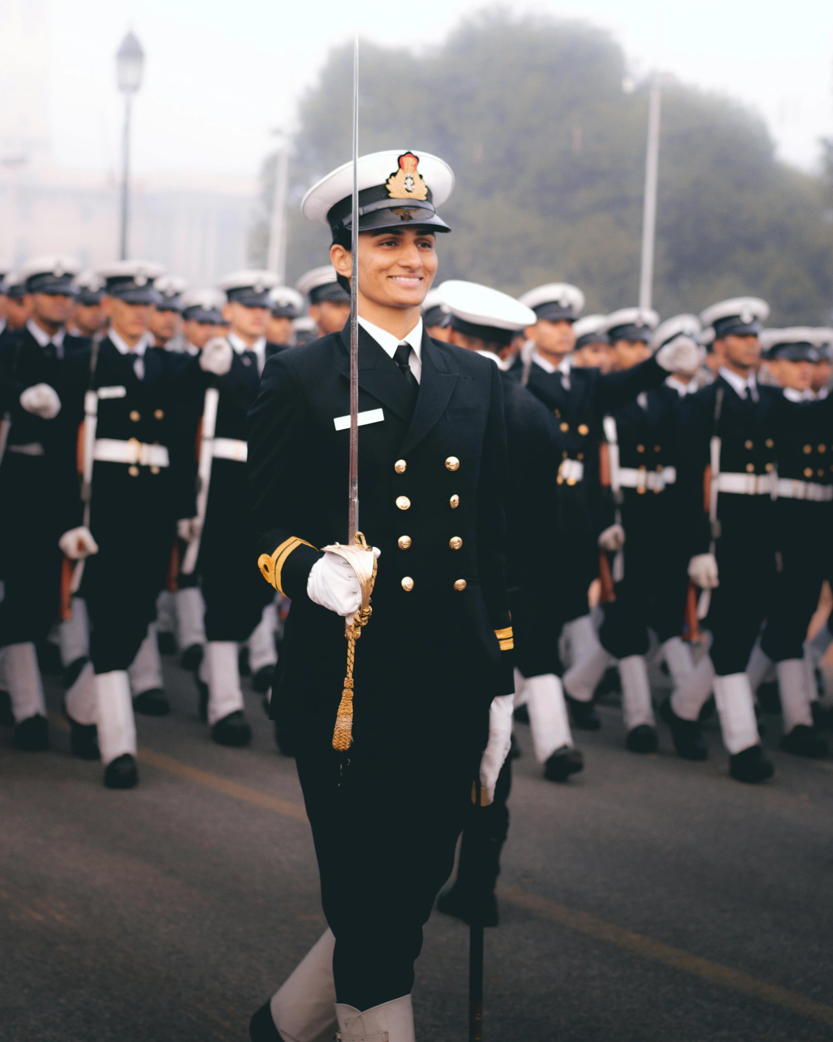 a parade is going by with a military man in uniform