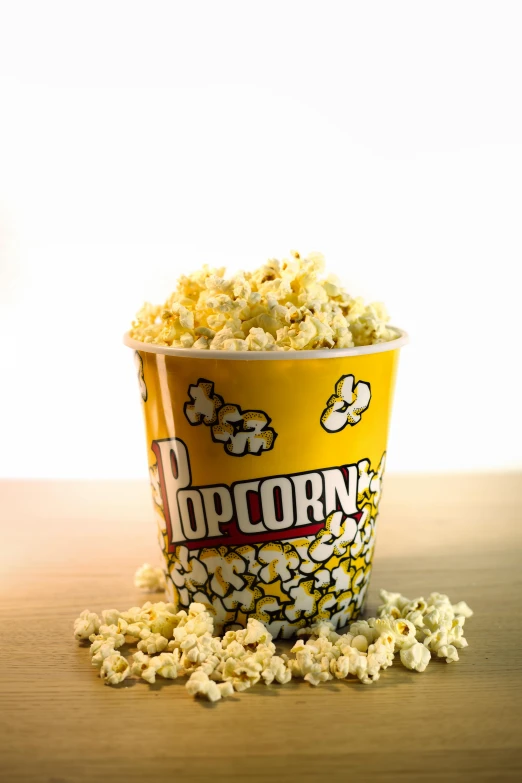 a popcorn bucket is sitting on top of the table