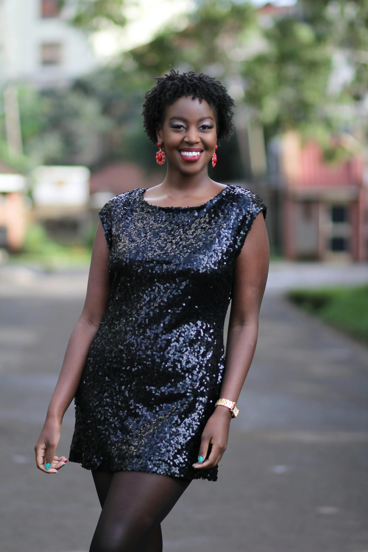 woman in black and silver dress with knee high heels