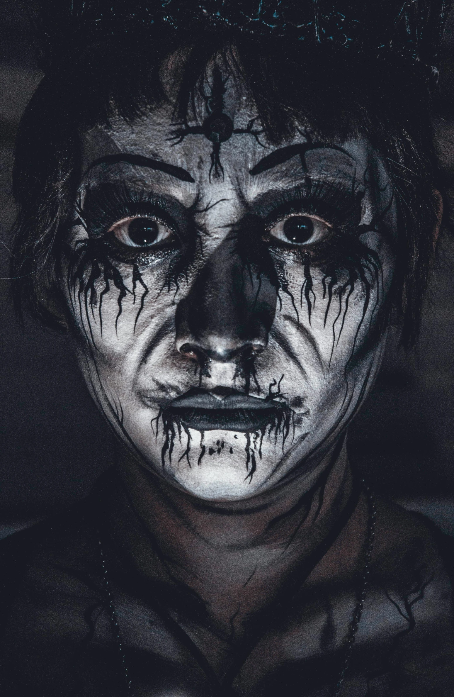 a man with his face painted black and white