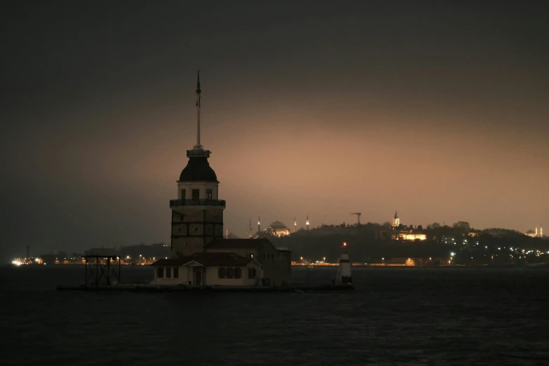 a tall tower sitting on top of the water