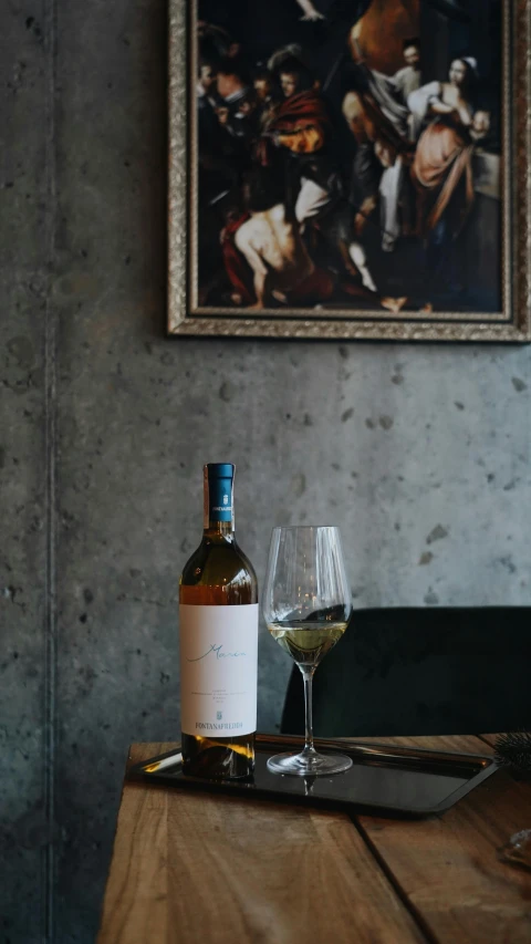 a po of some wine on a table in a restaurant