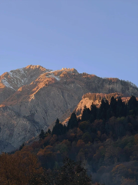 there is a beautiful view of some mountains and trees