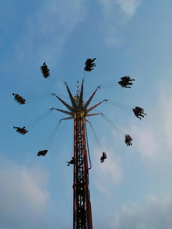 a ride is flying through the air with people in it