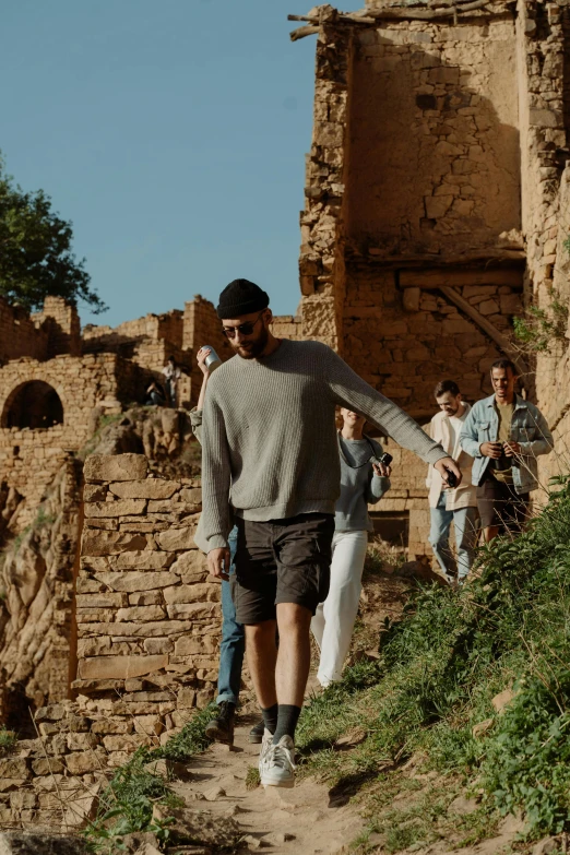 man walking up steps near a group of tourists