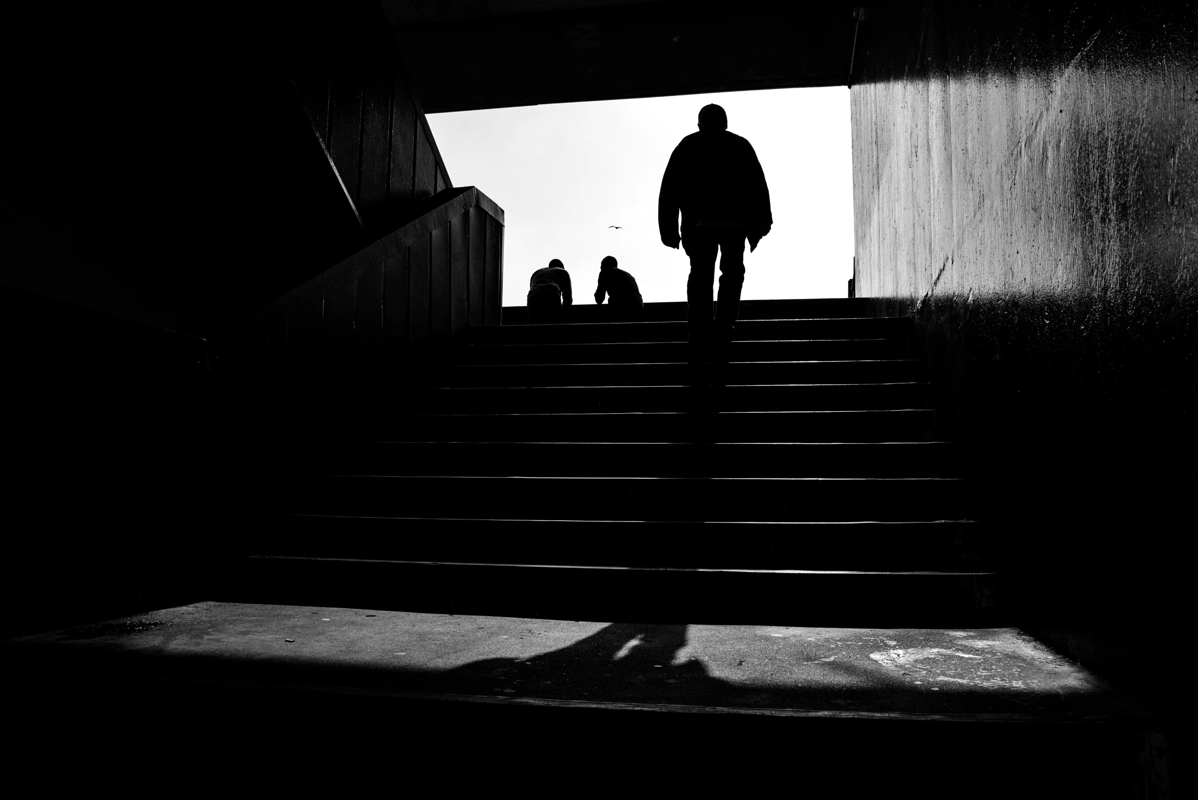 a group of people walking up some stairs