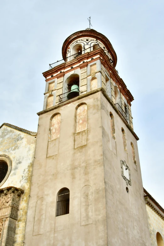 a clock tower with a bell on it