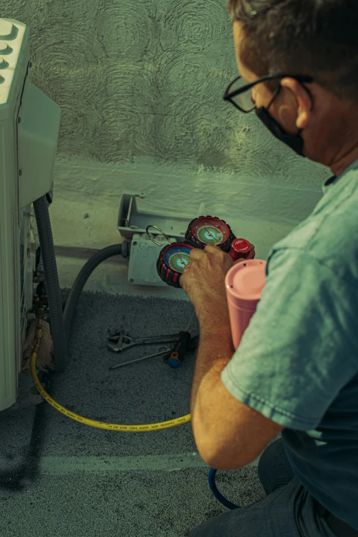 a man is fixing an electrical box with no wire