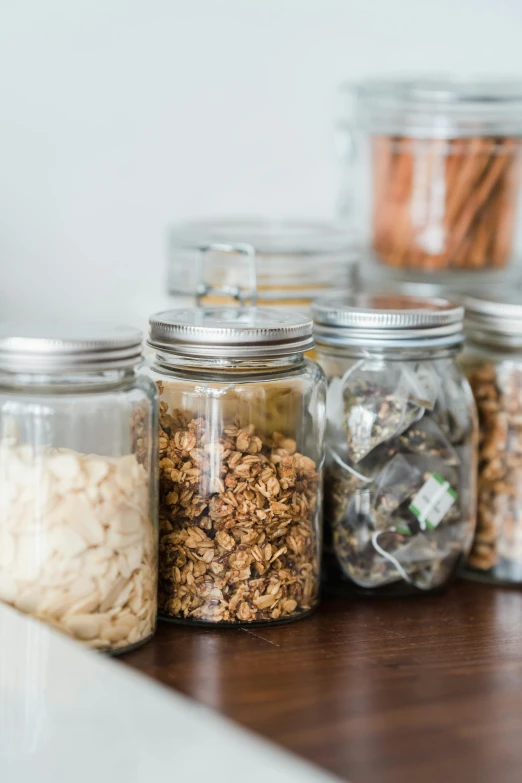 a close up of various jars on a shelf