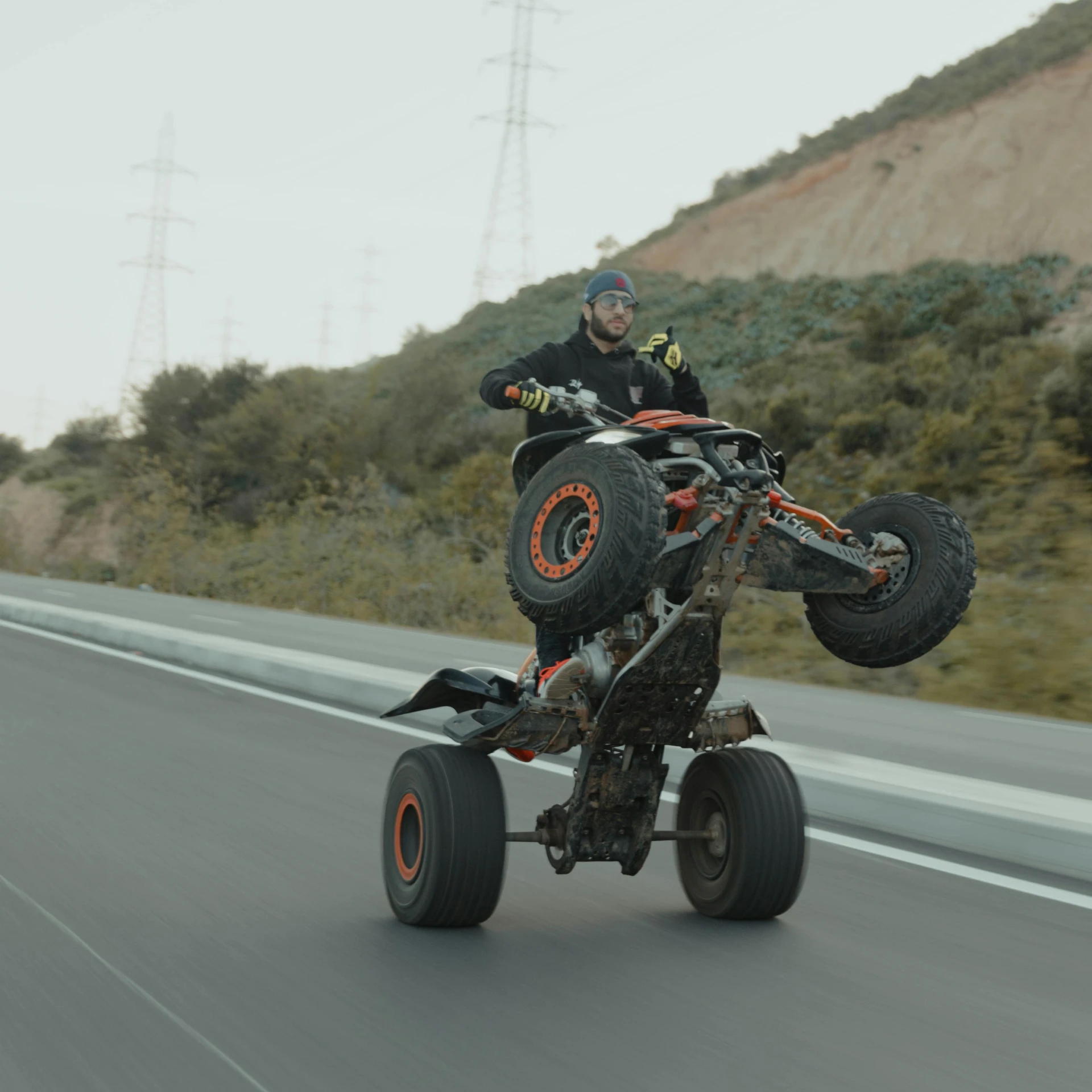 a man in full body kit riding a motorcycle