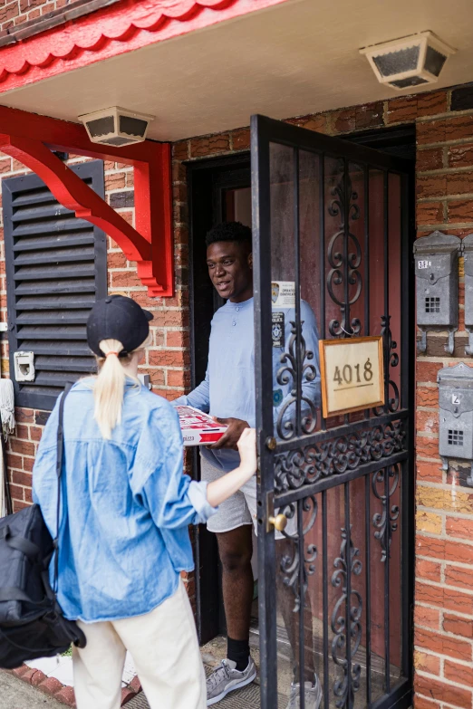 a person is entering the door to another person