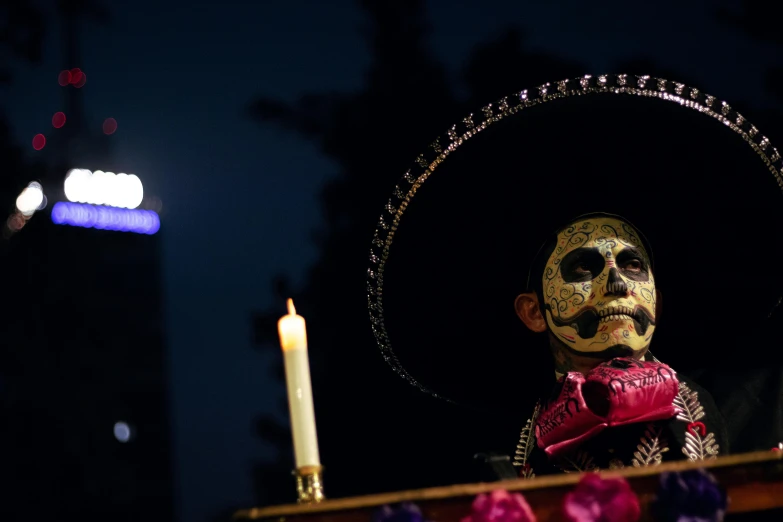 a man wearing a mexican mask and a face painting