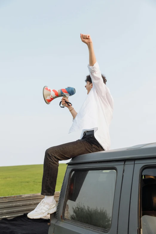 two boys jumping off the bed of a truck