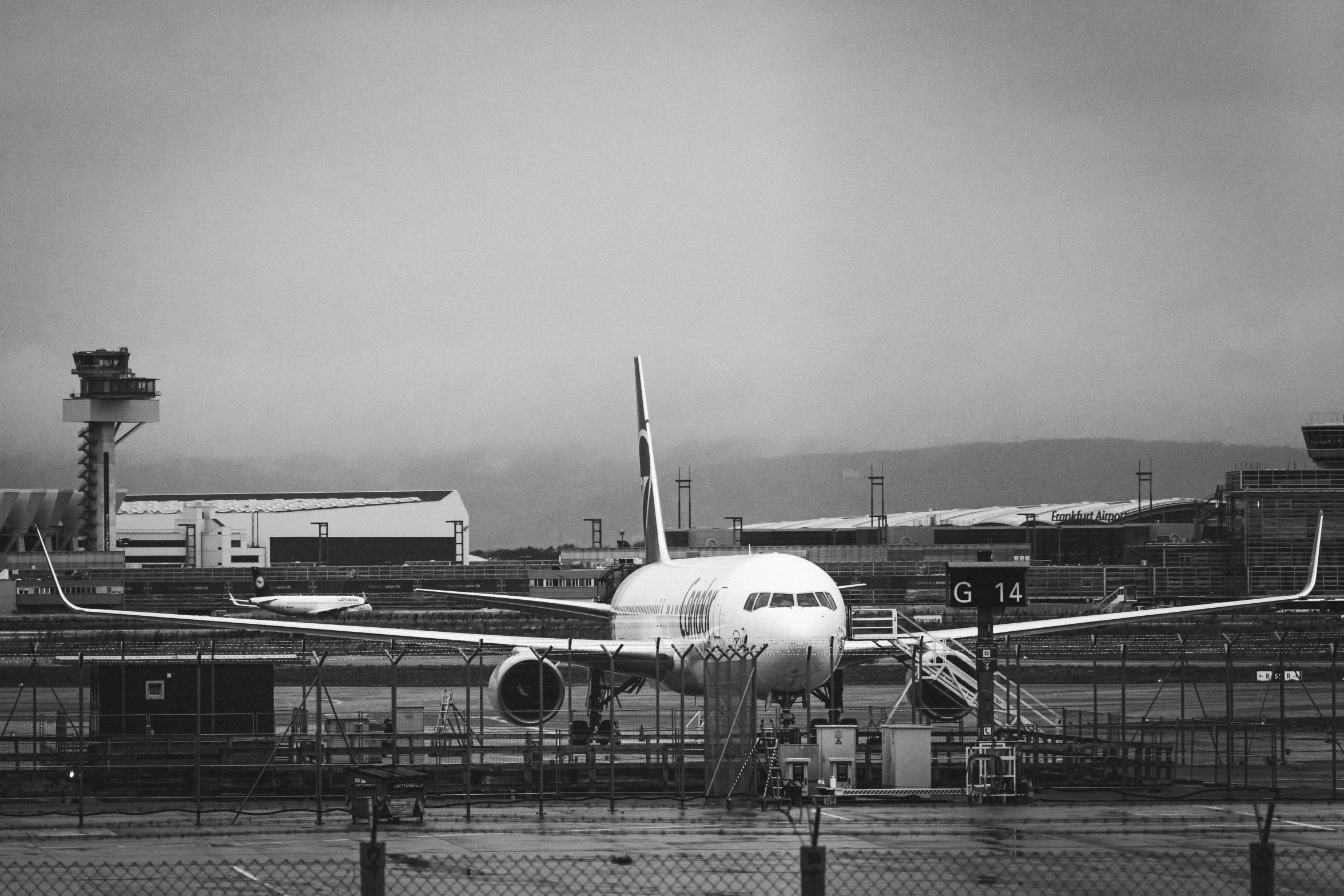 a plane is on the runway of an airport