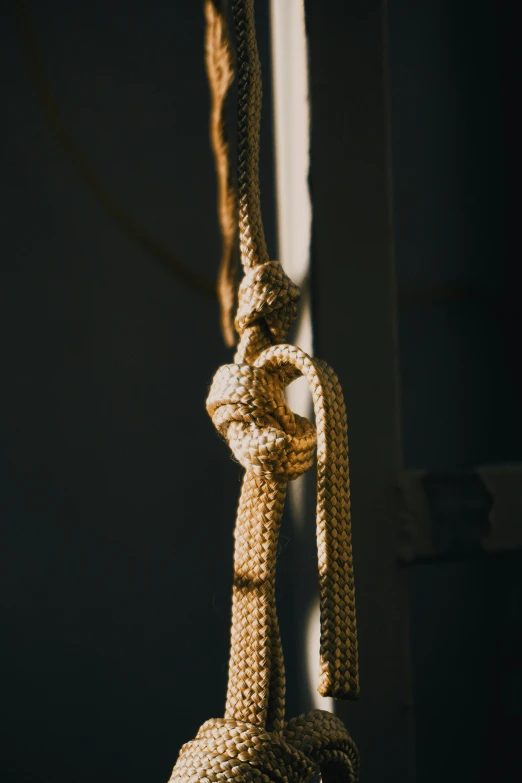 a rope hanging on the side of a building