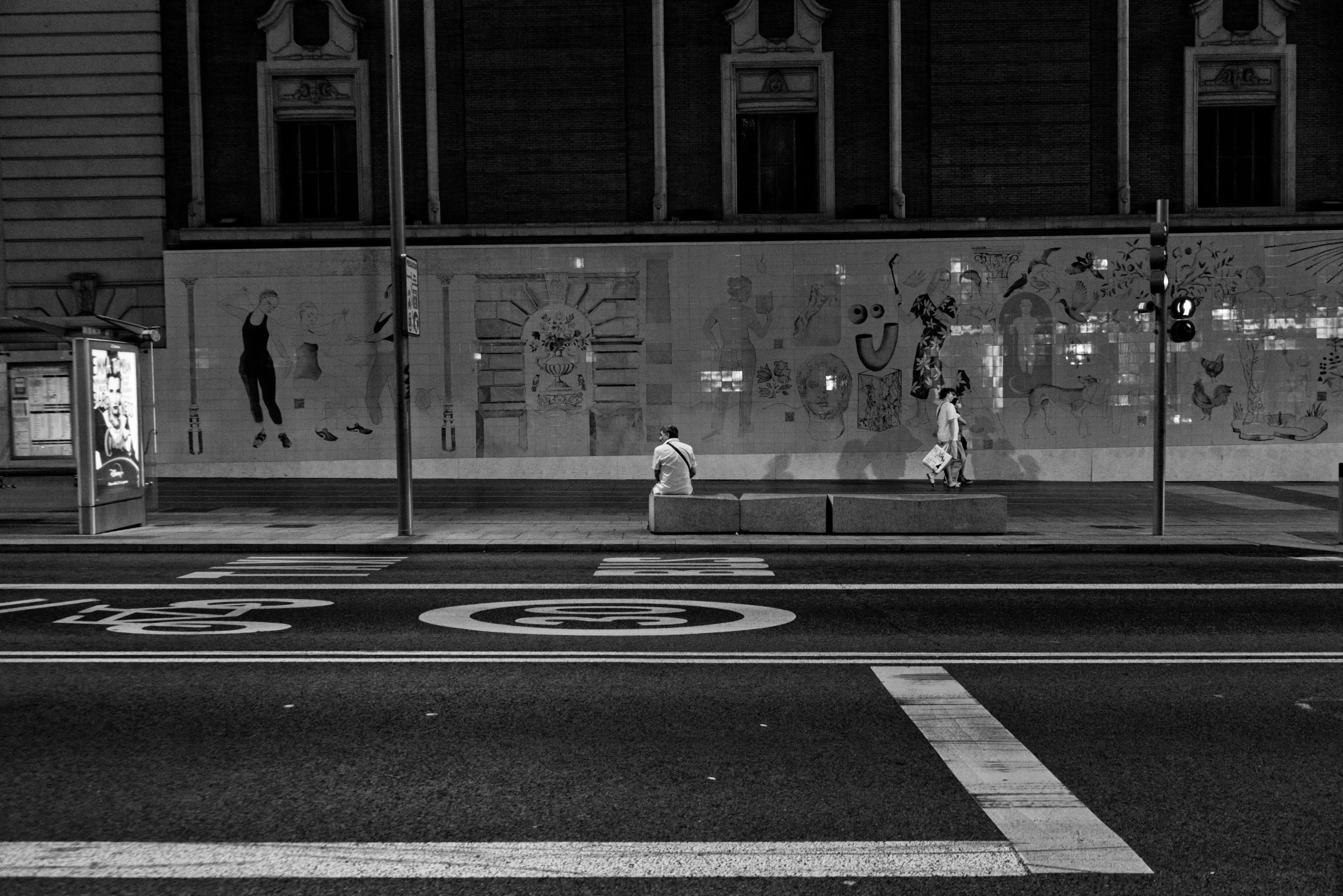 an urban street scene with a reflection of a building