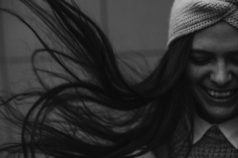 black and white pograph of girl with hair blowing