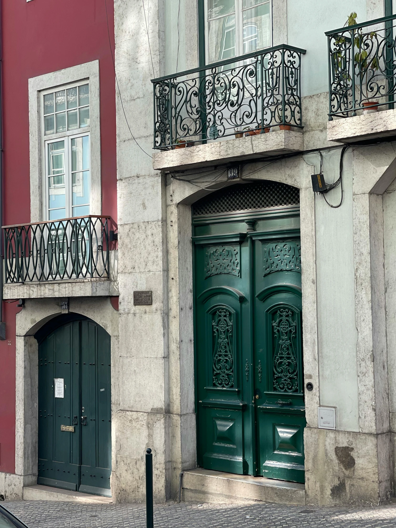 some very pretty doors on some buildings by the street