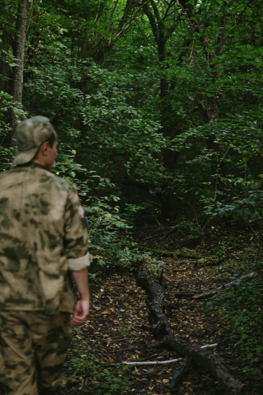 two people in the woods are talking with each other