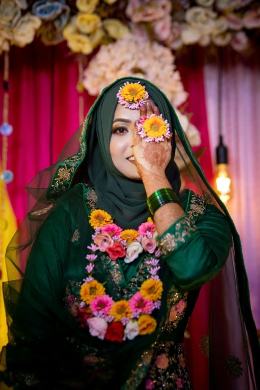 the bride wears a veil and flowers in her hair