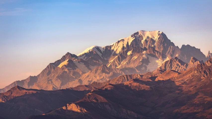 this mountain is seen here at dusk in the middle of winter