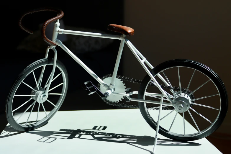 an old bicycle is displayed with only a tire