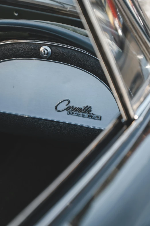 the front wheel of a classic black car