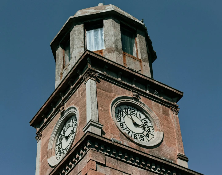 a big clock tower that is standing in the sky