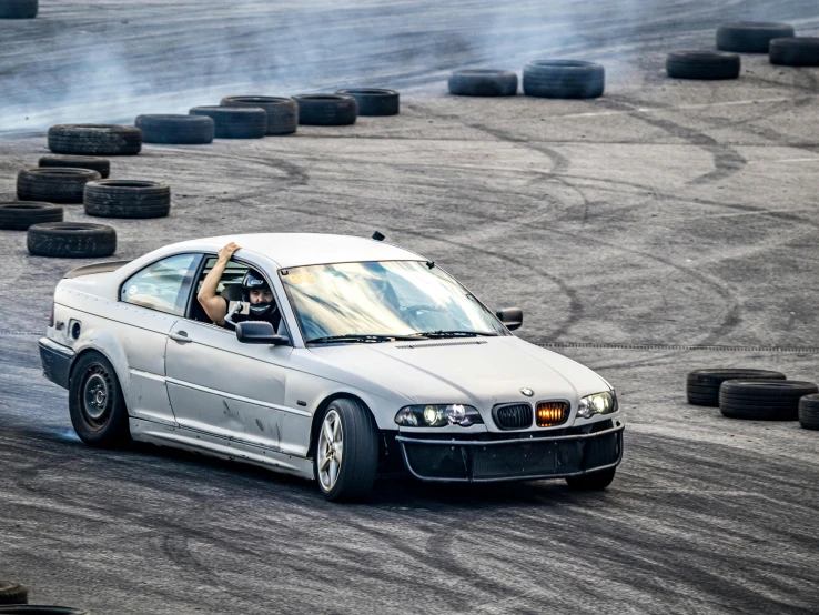 a person driving a car on a race track