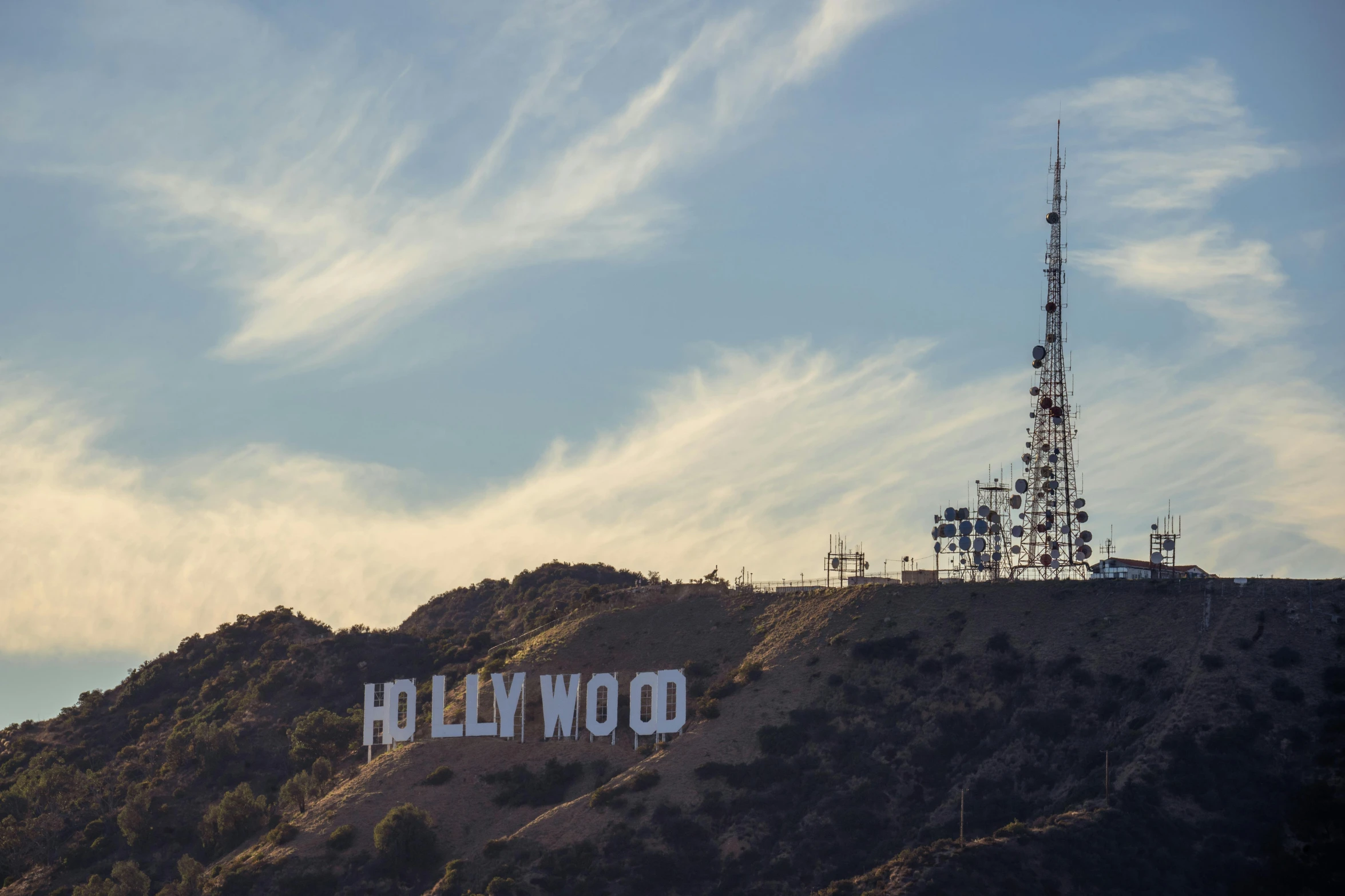 a sign on top of a hill that reads hollywood