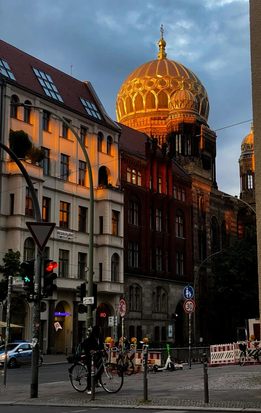 a street view of a small city with a dome