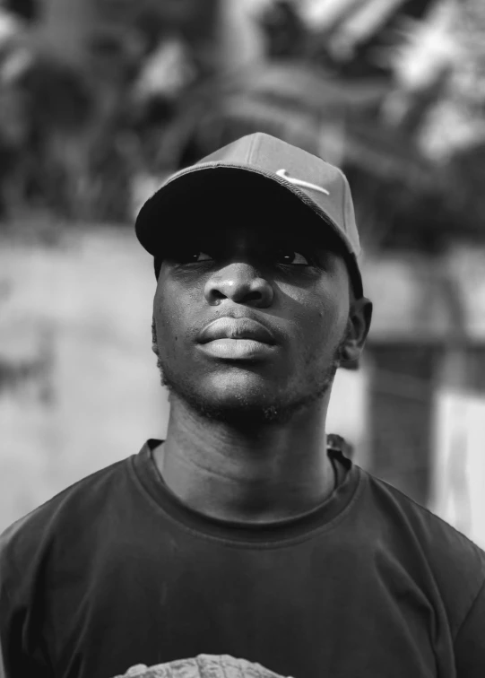 a black man with a hat and baseball glove