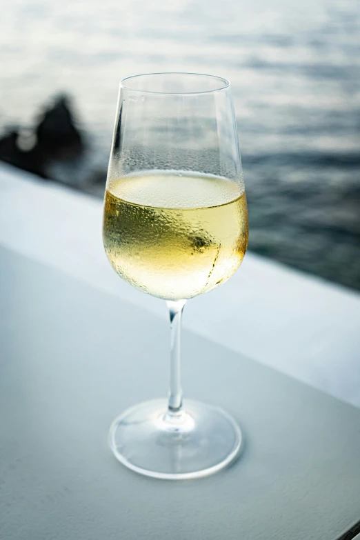 a glass of wine on the outside of the boat