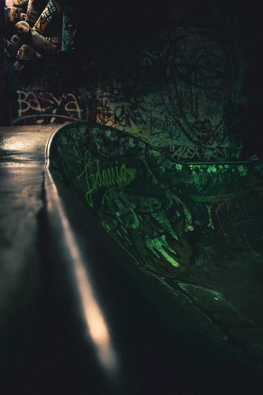 a skateboarder is doing tricks in the dark