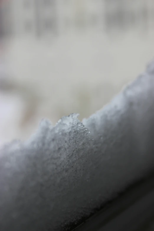 closeup of sugar that is sticking out of the top of a spoon