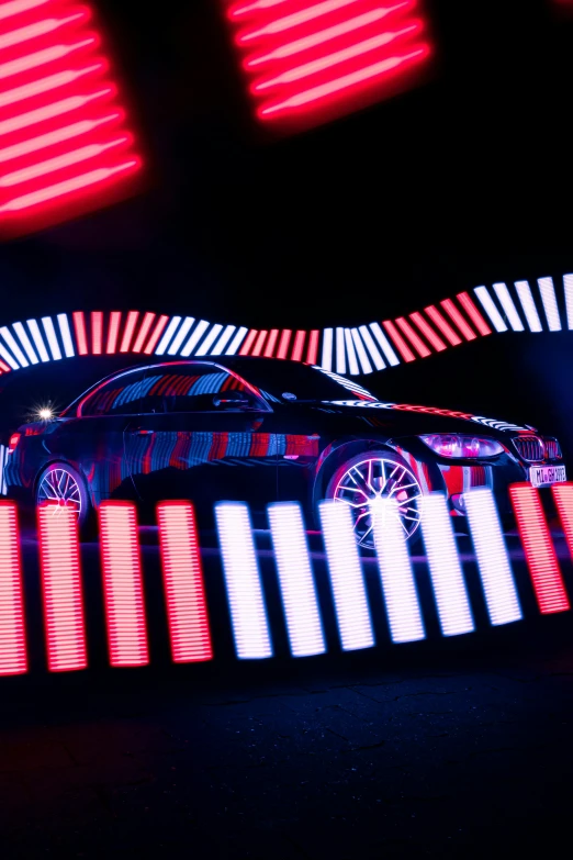 a car driving down a road with several colorful lights