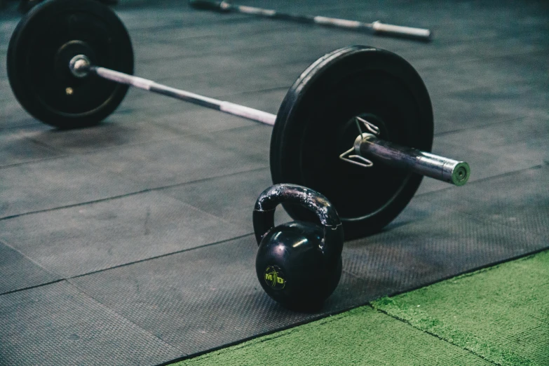 a black kettle and weight in a gym