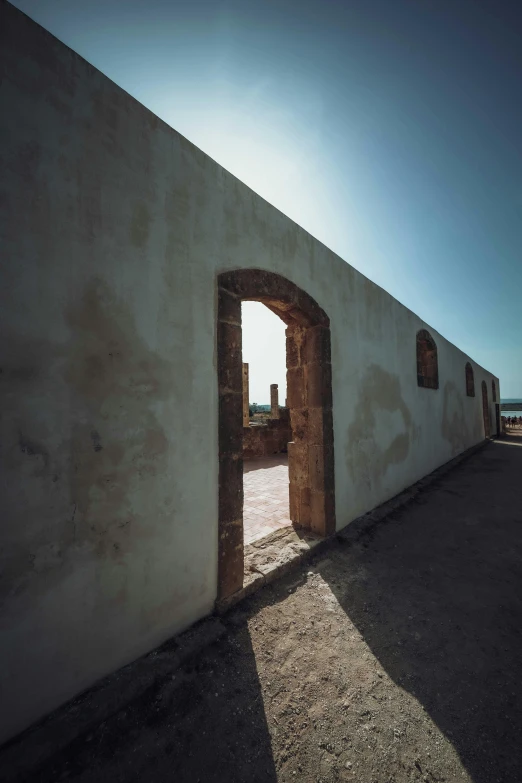 the open doorway of an old white building