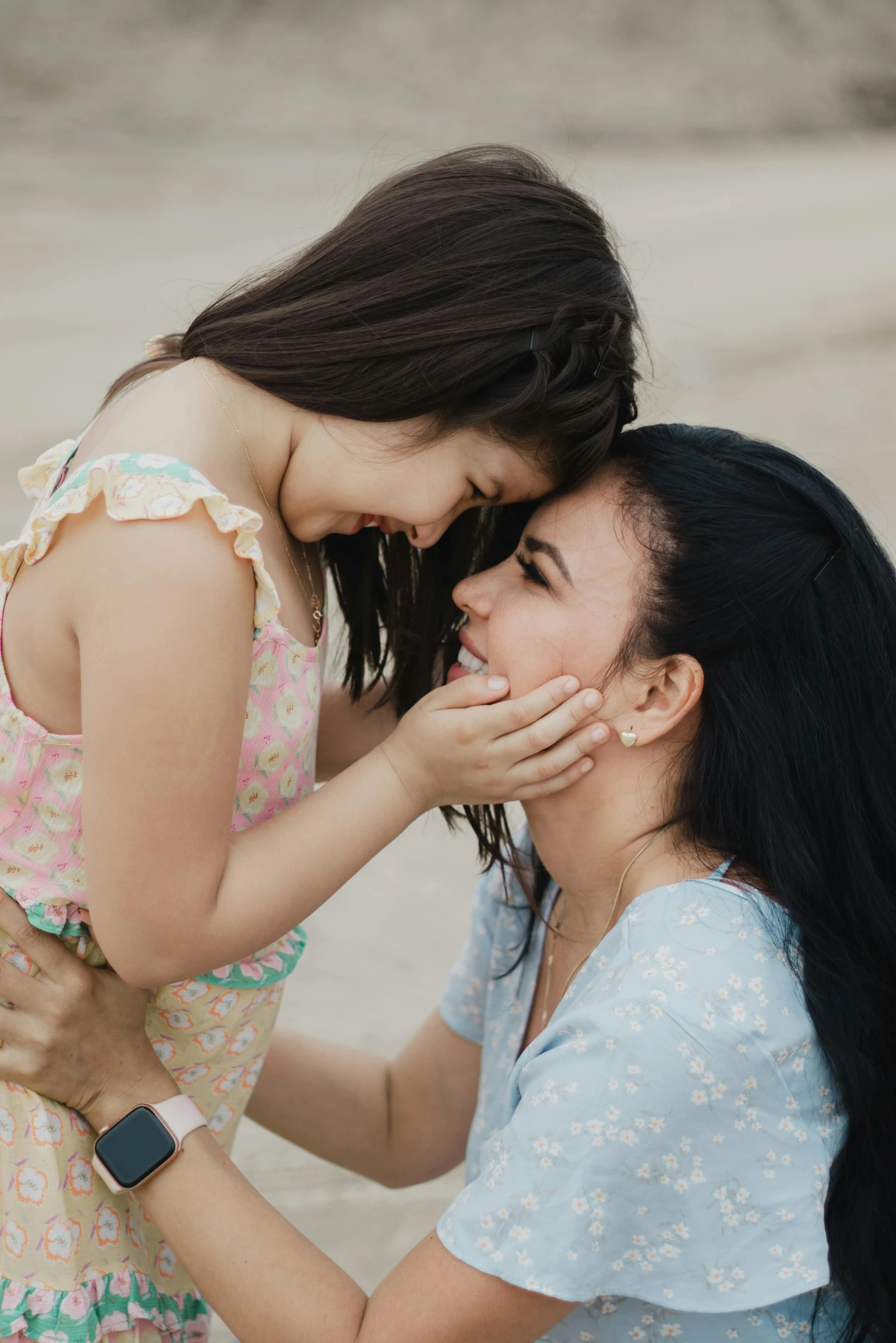 two girls are together on the street, one biting the other's tongue