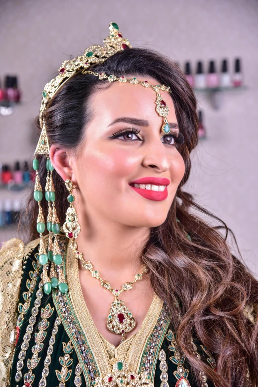 an attractive woman wearing a gold and green bridal