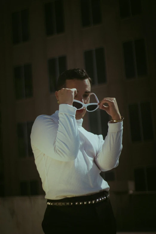 man dressed in business attire taking pictures with his camera