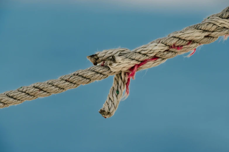 a close up of a rope that is being pulled down