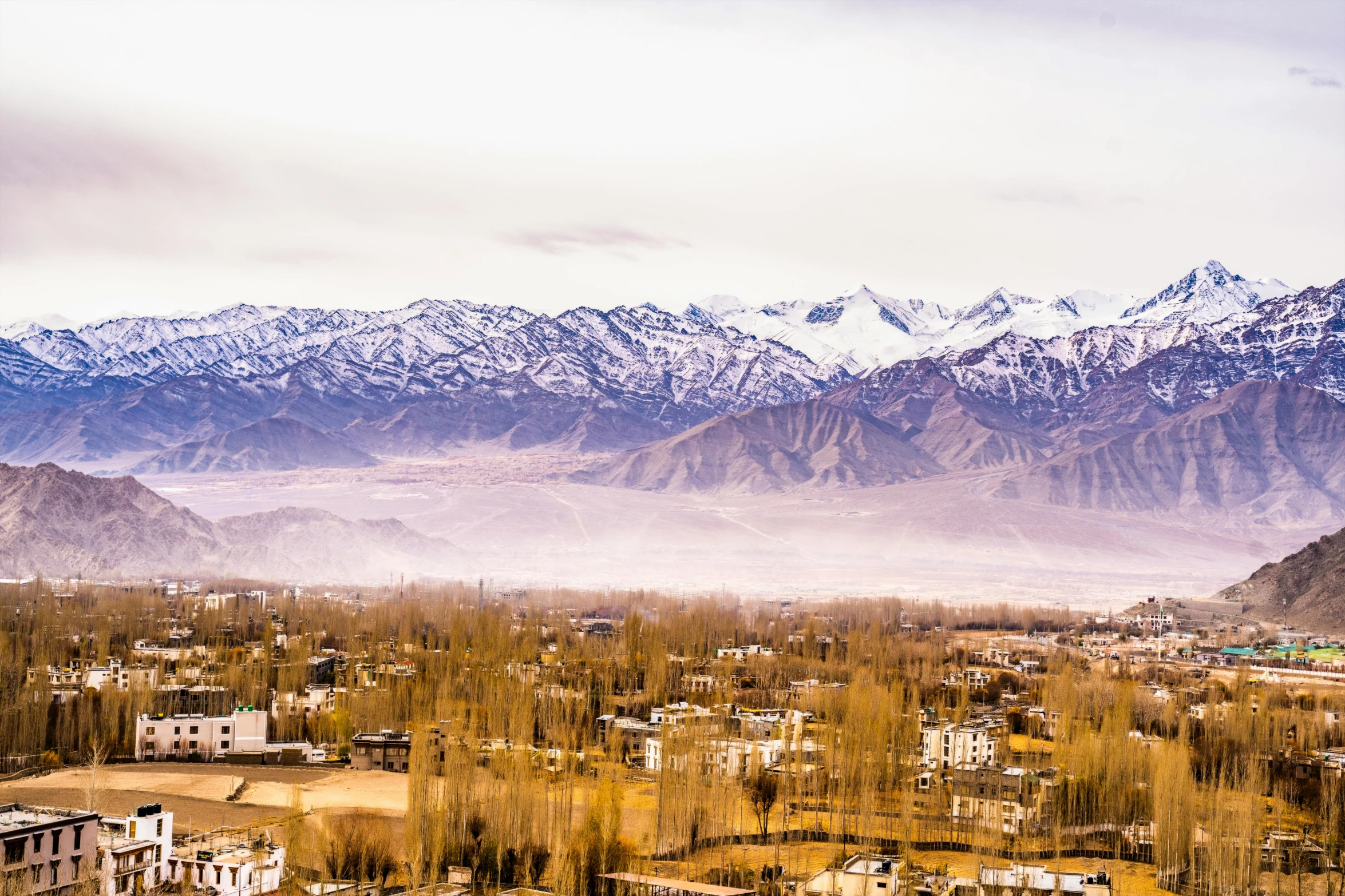 an aerial s of mountains in a city