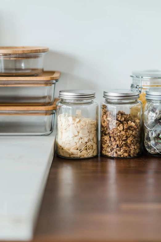 an assortment of different kinds of food in glass jars