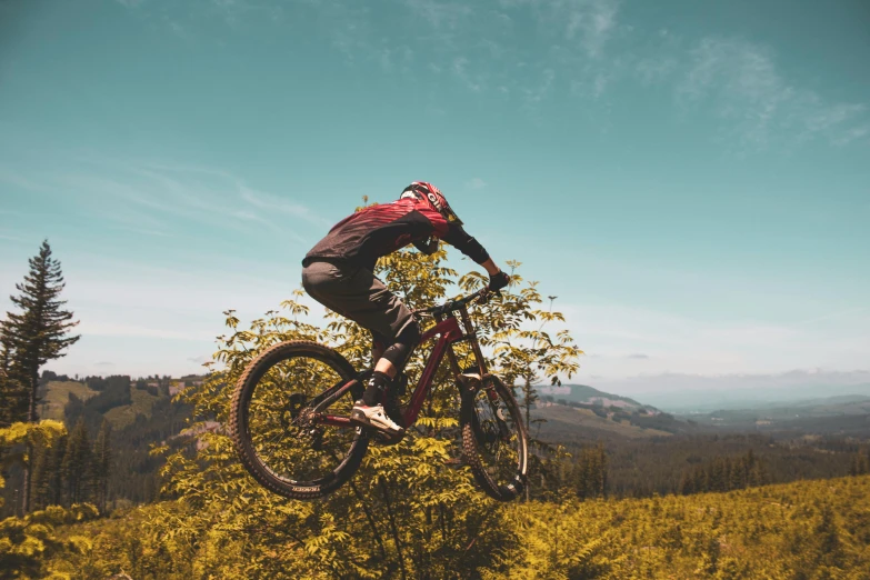 a man that is jumping his bike in the air